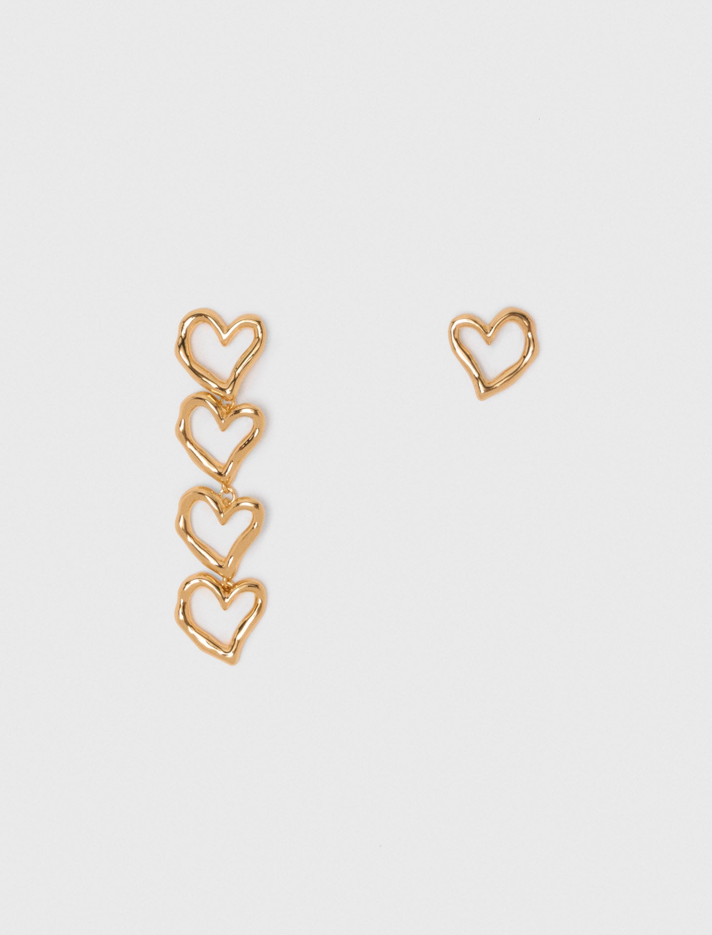 Asymmetric heart earrings