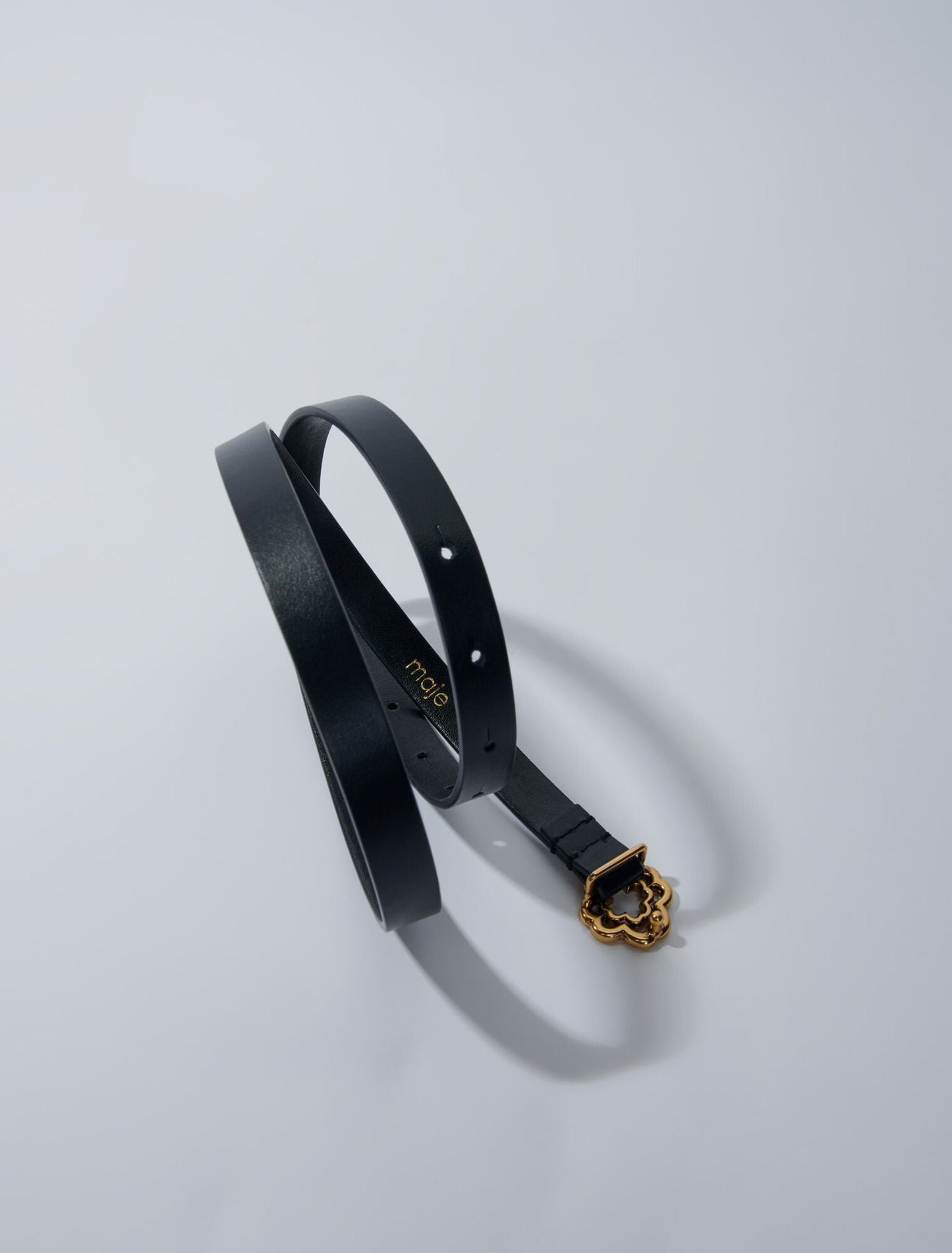 Black  -Narrow black leather belt gold buckle