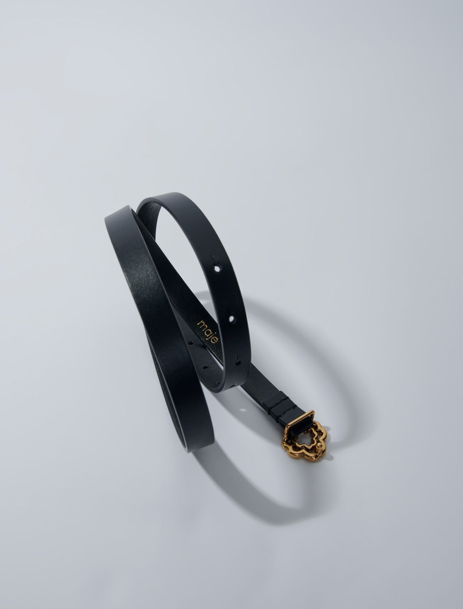 Black  -Narrow black leather belt gold buckle